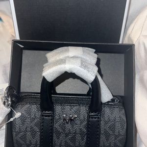 Brand new MK mini duffle bag key chain with tags and box!